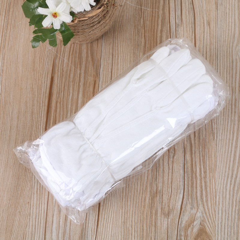 Pure white cotton point plastic gloves function various manufacturers direct sales.