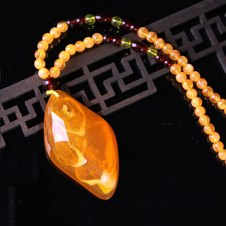 2020 New Retro Imitation Beeswax Yellow Chicken Grease Water Drop Pendant Creative Year Fish Necklace Sweater Chain Jewelry
