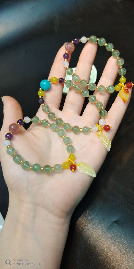 The natural green strawberry crystal bracelet matches The original mine beeswax pendant bracelet