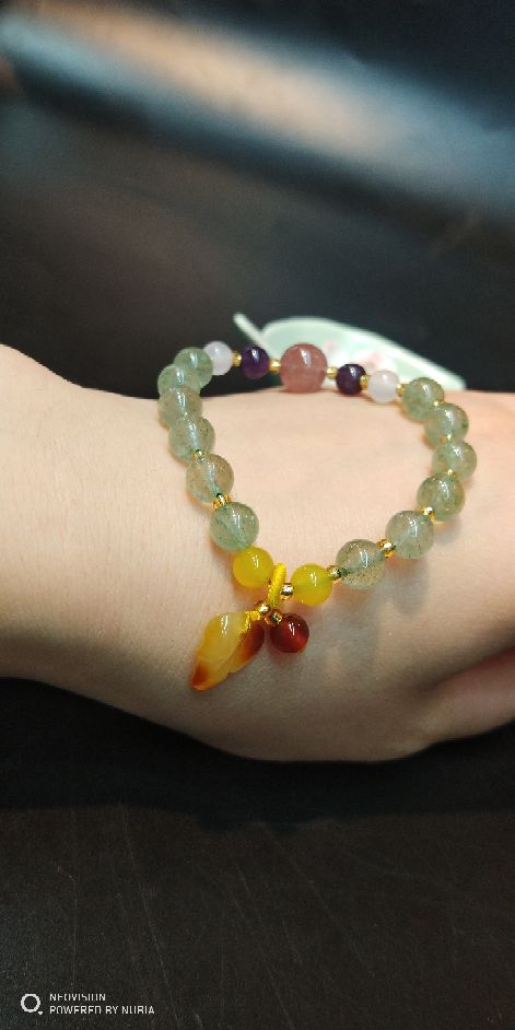 The natural green strawberry crystal bracelet matches The original mine beeswax pendant bracelet