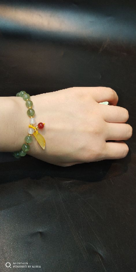 The natural green strawberry crystal bracelet matches The original mine beeswax pendant bracelet