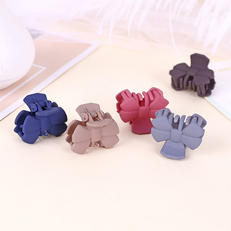Manufacturers direct South Korea broken hair top clip clips hair ornaments personality solid color bowknot plastic headwear grips