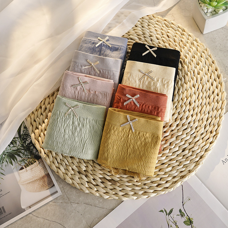 Japanese Style Seamless Underwear Massage High Elastic Seamless Cotton Stall Breathable Mid Waist Hip Lift Comfort Bow Briefs for Women