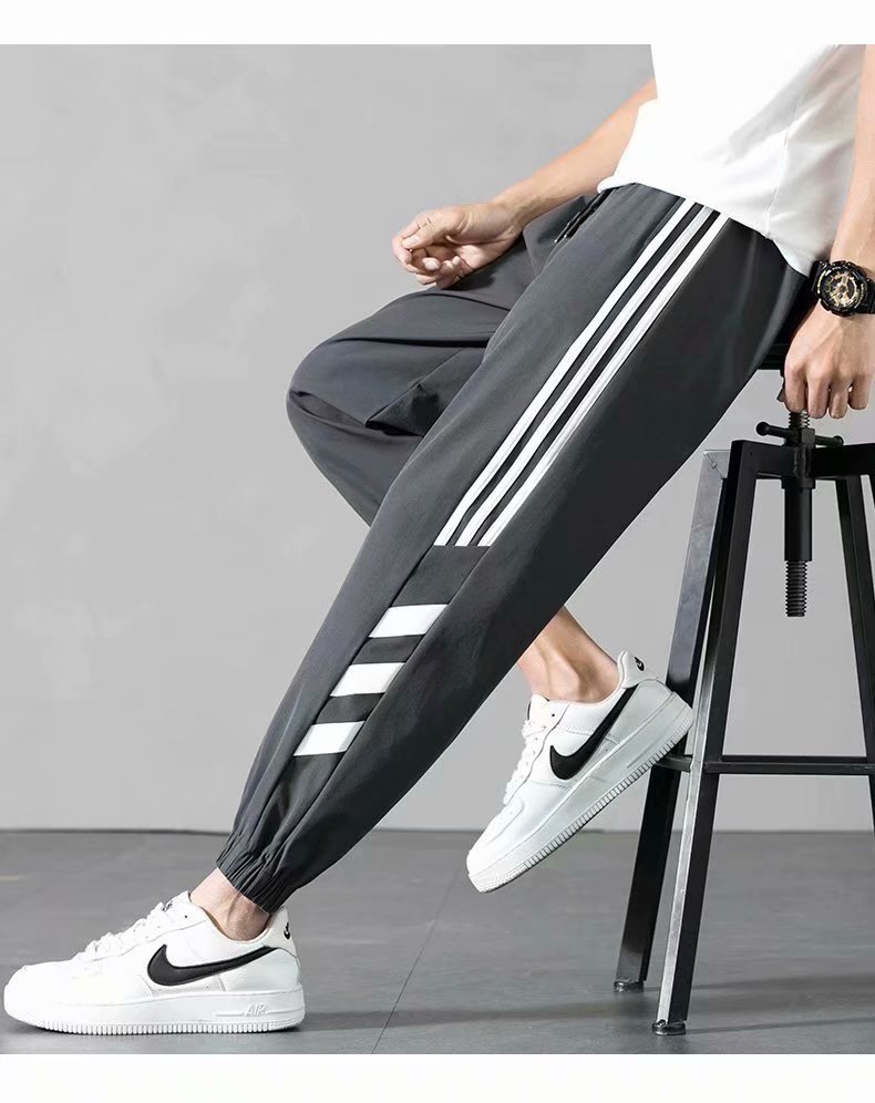Sports Pants Men's Autumn Loose Cropped Casual Pants Trend Stripes Campus Loose Tappered Internet Celebrity Men's Ninth Pants Sports Pants Men's Autumn Loose Cropped Casual Pants Trend Stripes Campus Loose Tappered Internet Celebrity Men's Ninth Pants