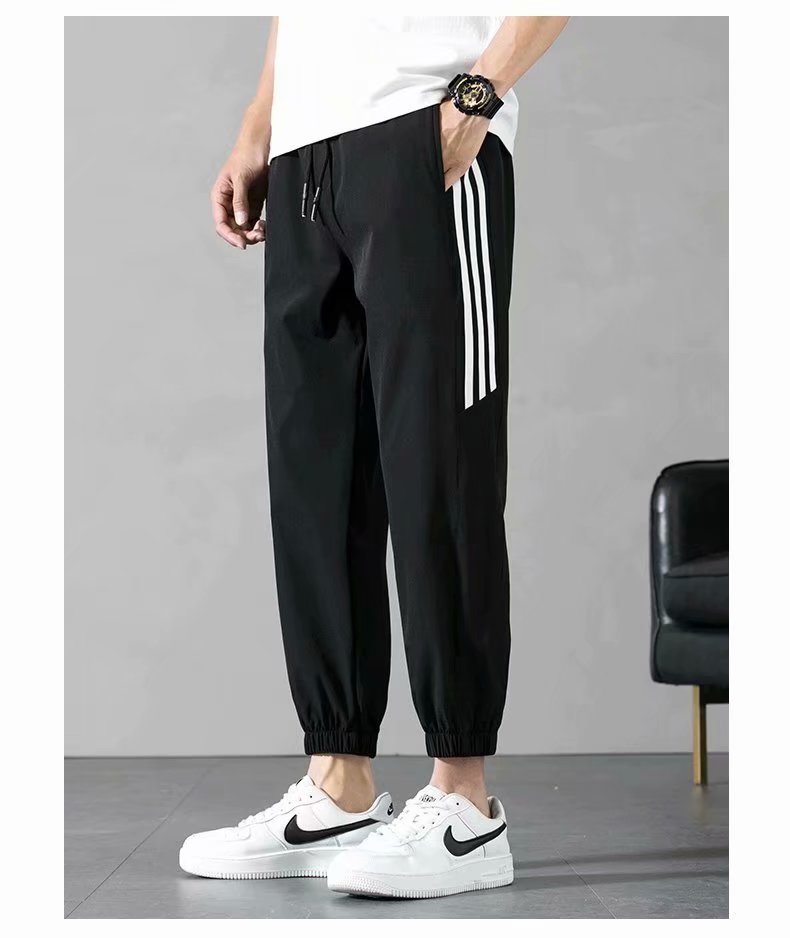 Sports Pants Men's Autumn Loose Cropped Casual Pants Trend Stripes Campus Loose Tappered Internet Celebrity Men's Ninth Pants Sports Pants Men's Autumn Loose Cropped Casual Pants Trend Stripes Campus Loose Tappered Internet Celebrity Men's Ninth Pants