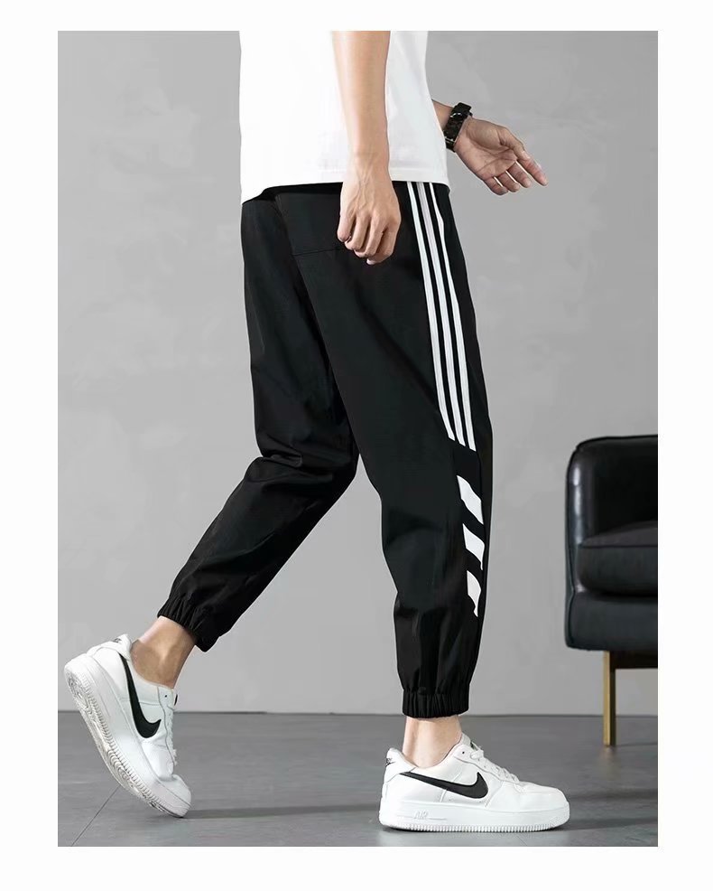 Sports Pants Men's Autumn Loose Cropped Casual Pants Trend Stripes Campus Loose Tappered Internet Celebrity Men's Ninth Pants Sports Pants Men's Autumn Loose Cropped Casual Pants Trend Stripes Campus Loose Tappered Internet Celebrity Men's Ninth Pants