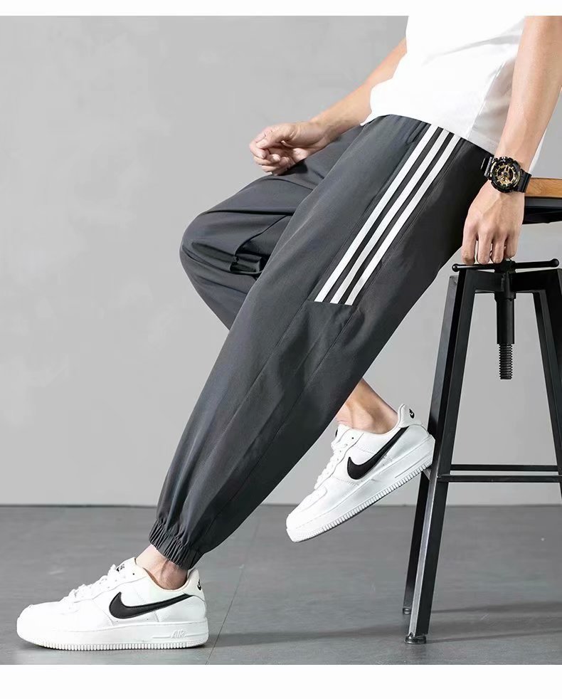 Sports Pants Men's Autumn Loose Cropped Casual Pants Trend Stripes Campus Loose Tappered Internet Celebrity Men's Ninth Pants Sports Pants Men's Autumn Loose Cropped Casual Pants Trend Stripes Campus Loose Tappered Internet Celebrity Men's Ninth Pants