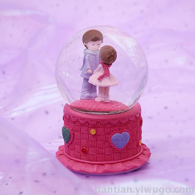 The whole family has excellent presents a couple holding hands with a crystal ball music box dreamlike glow Snowflake music box