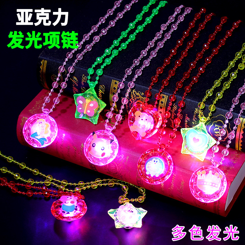 The ground stall sells novelty toys to shine necklace led flash yakeli bead cartoon pendant child gift