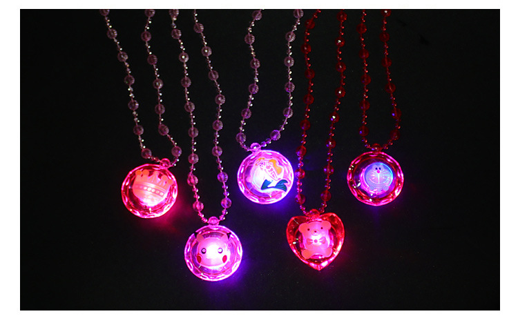 The ground stall sells novelty toys to shine necklace led flash yakeli bead cartoon pendant child gift