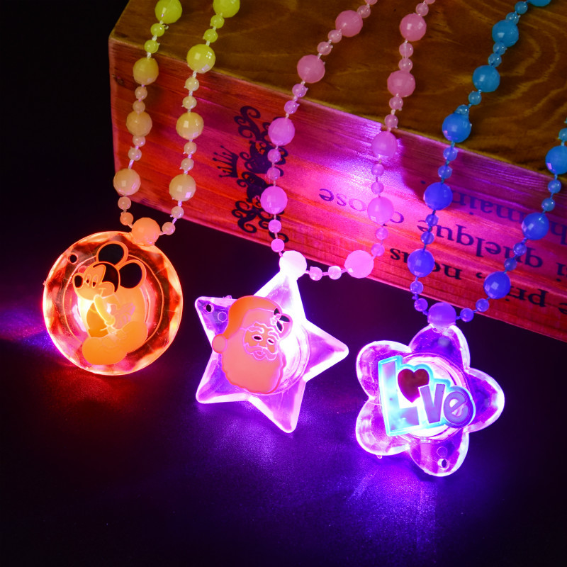 The ground stall sells novelty toys to shine necklace led flash yakeli bead cartoon pendant child gift