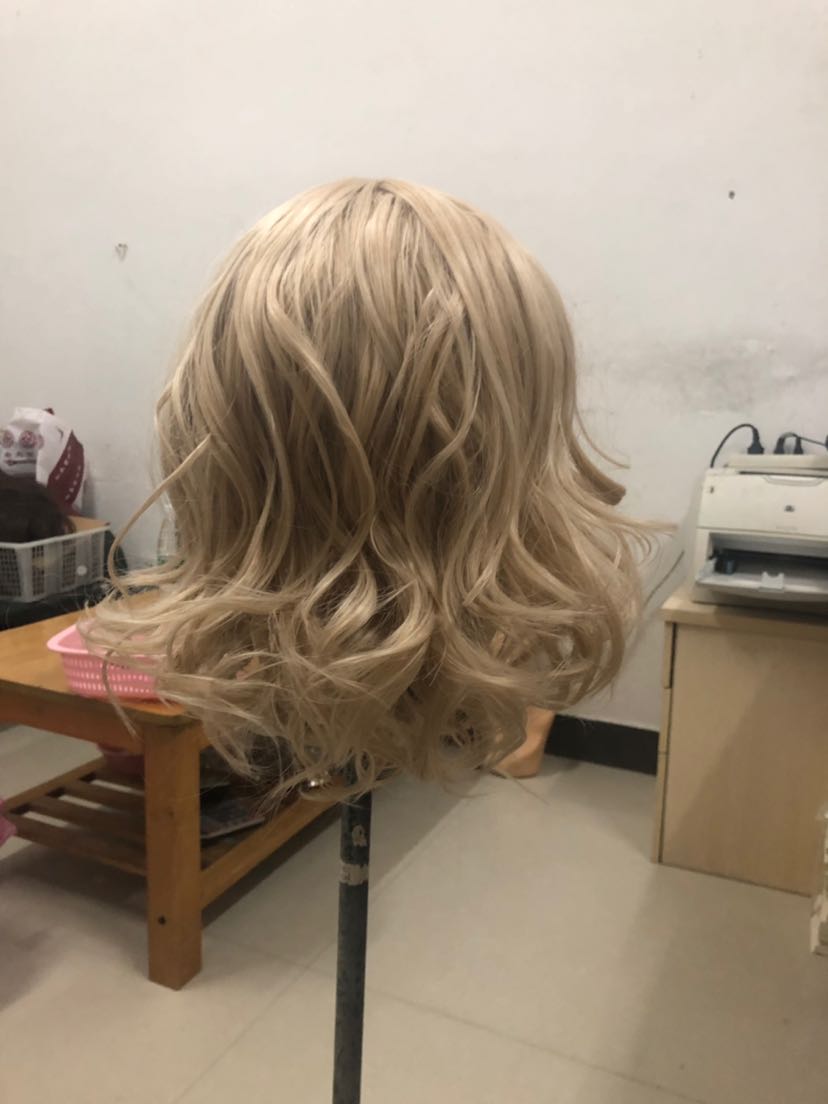 A blonde wig with natural curls