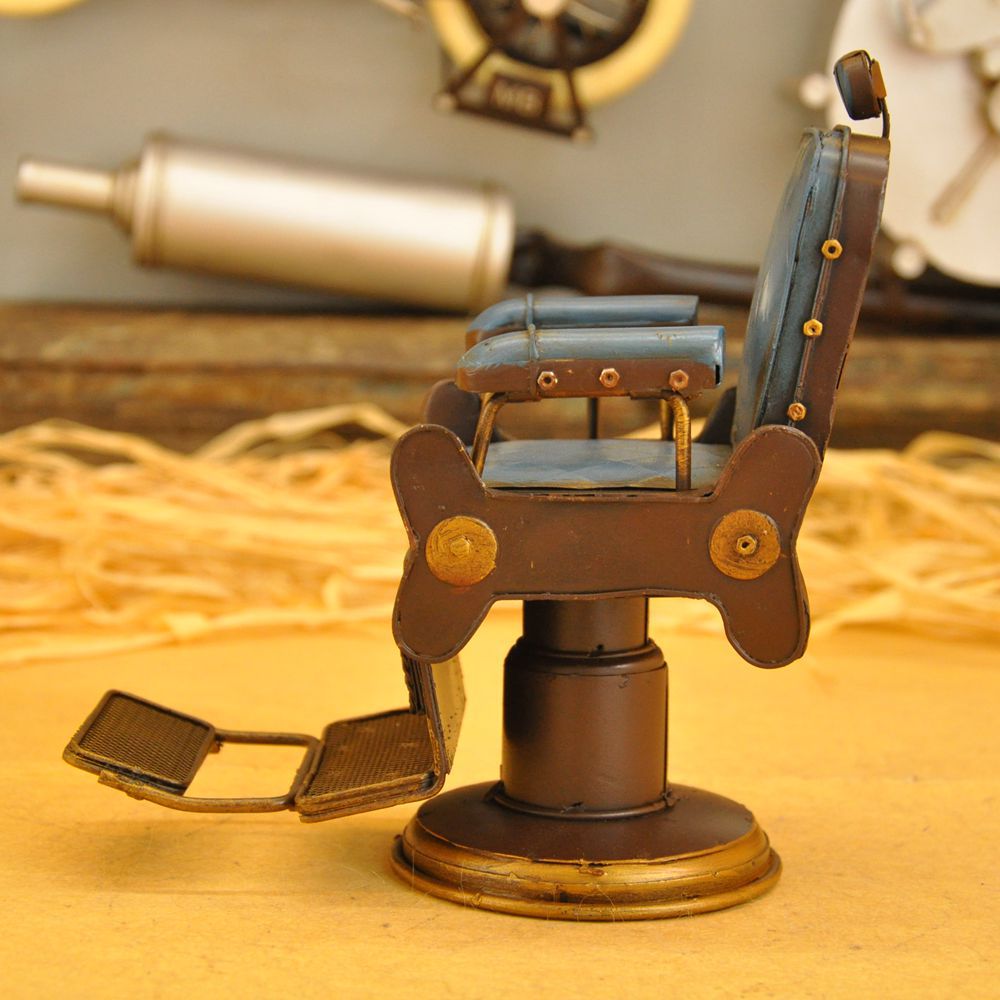 Vintage iron art for the cash register counter props creative tin American barbershop chairs small model crafts. Vintage iron art for the cash register counter props creative tin American barbershop chairs small model crafts.