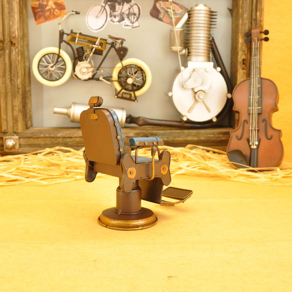 Vintage iron art for the cash register counter props creative tin American barbershop chairs small model crafts. Vintage iron art for the cash register counter props creative tin American barbershop chairs small model crafts.