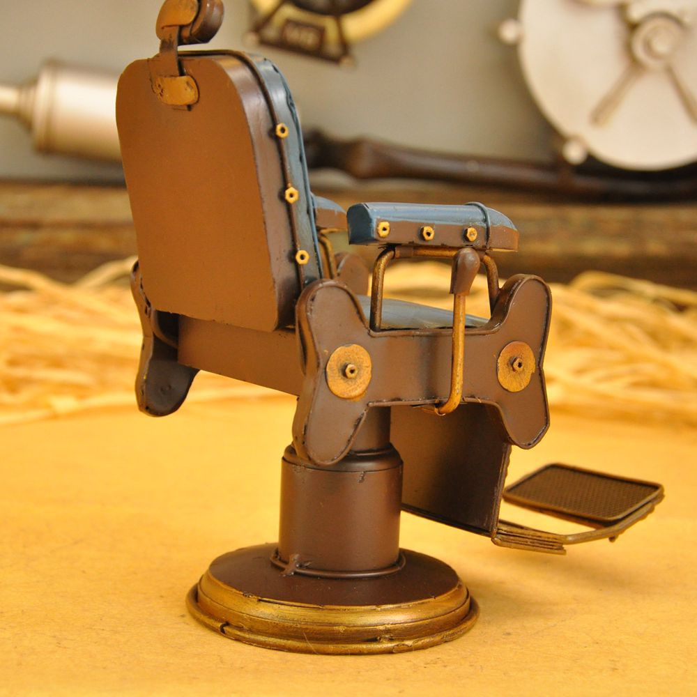 Vintage iron art for the cash register counter props creative tin American barbershop chairs small model crafts. Vintage iron art for the cash register counter props creative tin American barbershop chairs small model crafts.