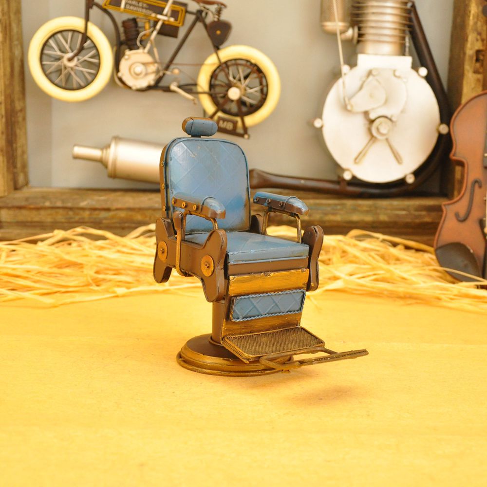 Vintage iron art for the cash register counter props creative tin American barbershop chairs small model crafts. Vintage iron art for the cash register counter props creative tin American barbershop chairs small model crafts.