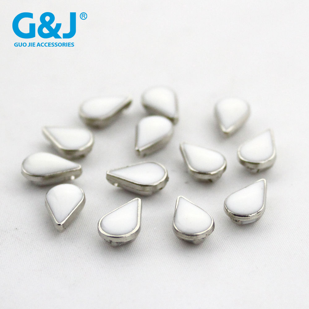 ABS plastic electroplated drip-drip, four-hole shirt button with high drop button.