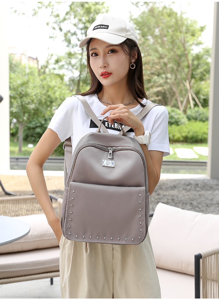 Foreign Trade Wholesale Spring and Autumn New Trendy Japanese and Korean Style Casual Temperament Sports Rivet XINGX Nylon Backpack Women's Bag Foreign Trade Wholesale Spring and Autumn New Trendy Japanese and Korean Style Casual Temperament Sports Rivet XINGX Nylon Backpack Women's Bag