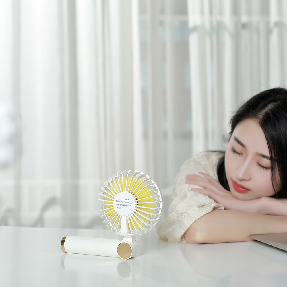 Rotary folding small fan USB charging handheld mini desktop small fan with charging pad function Rotary folding small fan USB charging handheld mini desktop small fan with charging pad function