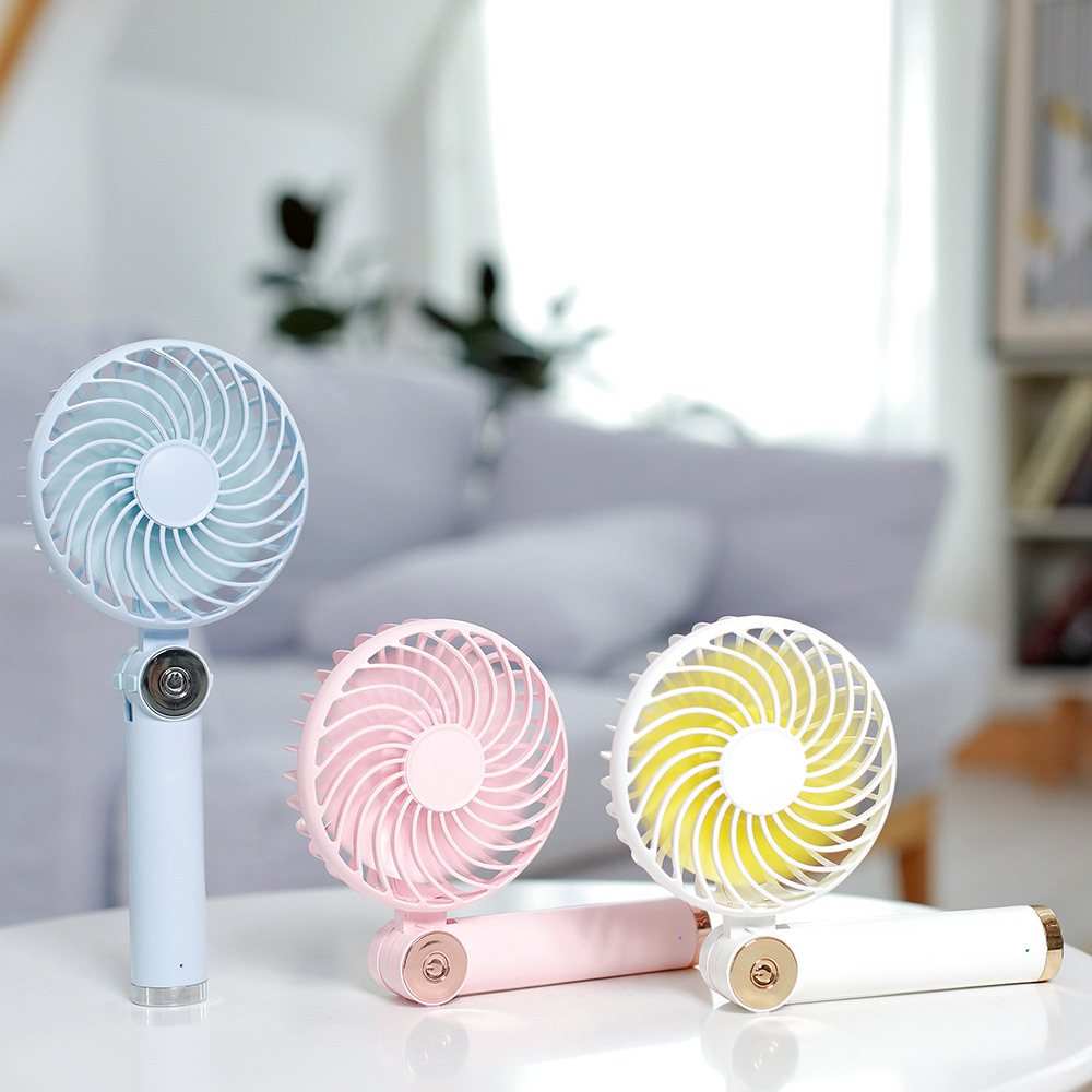 Rotary folding small fan USB charging handheld mini desktop small fan with charging pad function Rotary folding small fan USB charging handheld mini desktop small fan with charging pad function