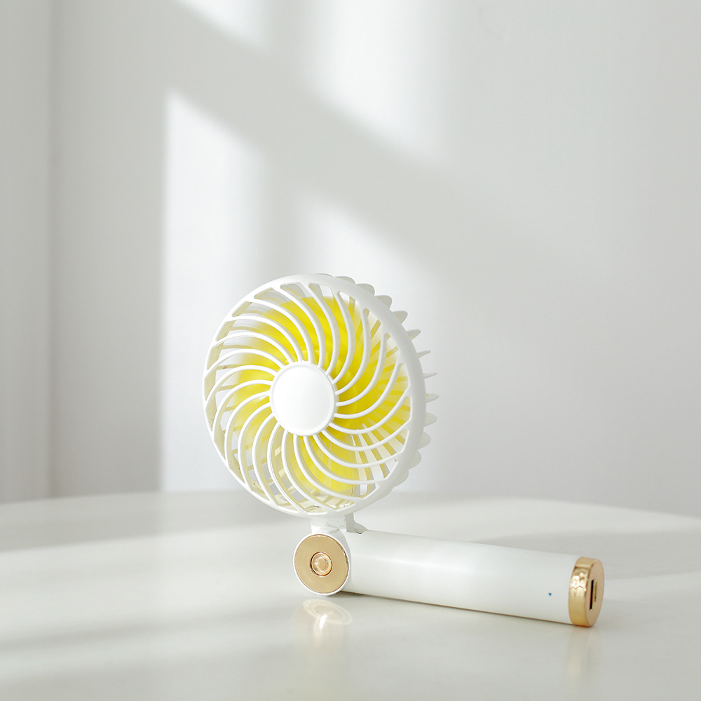 Rotary folding small fan USB charging handheld mini desktop small fan with charging pad function Rotary folding small fan USB charging handheld mini desktop small fan with charging pad function