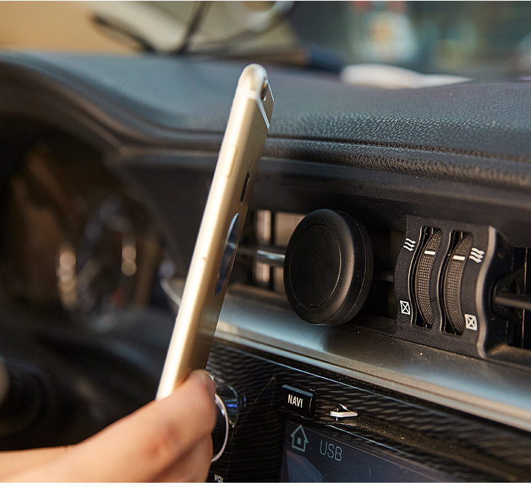 Car bracket mobile phone magnet air conditioning outlet magnetic phone folder car