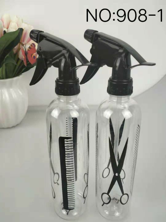 Hairdressing scissors, a spray bottle