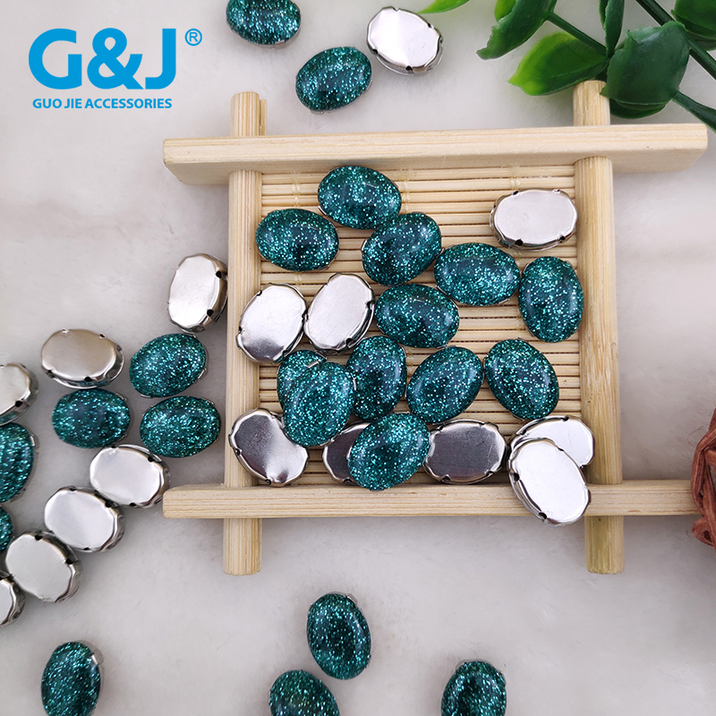 Oval egg-shaped clawless glue stone hand sewing on the four-hole claw drill hand-nailing bead button garment 