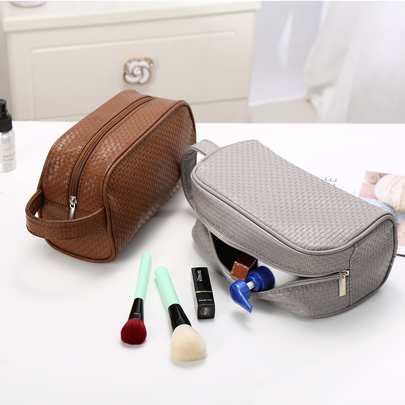 A New simple pure color men &#039;s leather storage bag multifunctional travel waterproof wash bag dust - proof makeup bag for women