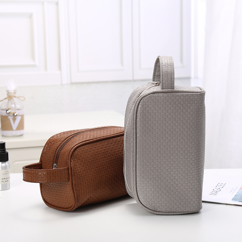 A New simple pure color men &#039;s leather storage bag multifunctional travel waterproof wash bag dust - proof makeup bag for women