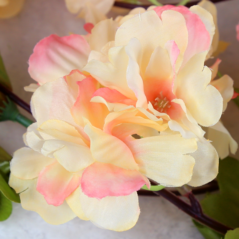 Artificial flower wrapped flower - winding, air - conditioning duct, plastic silk flower pipe wall hanging background.