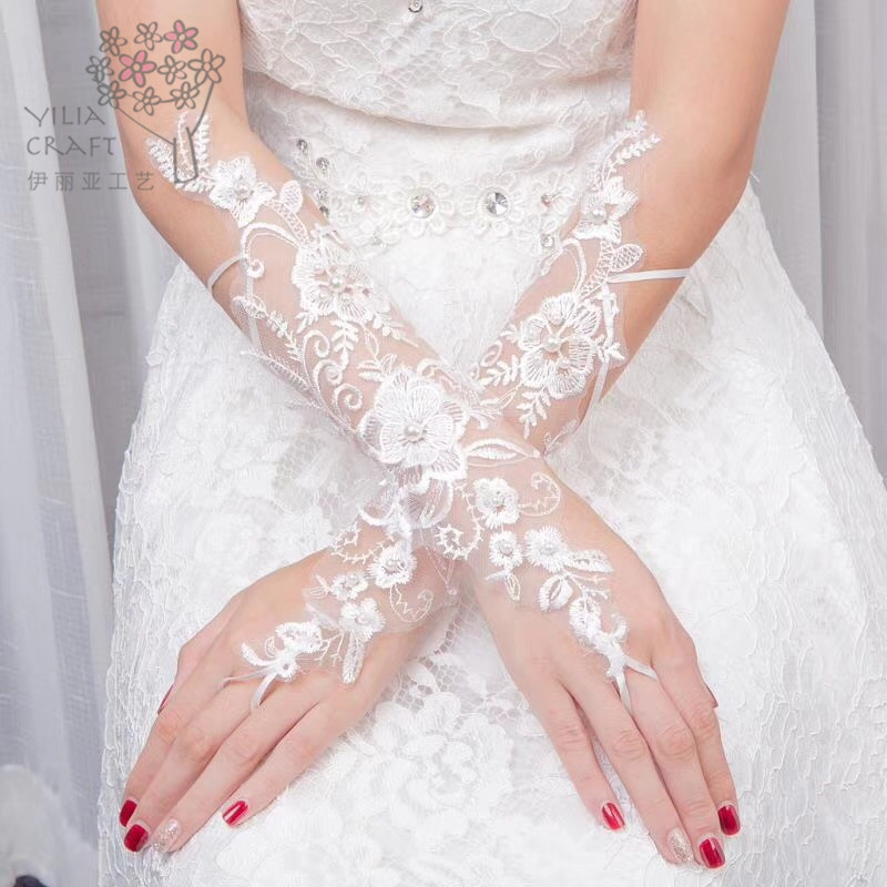 Han edition bride&#039;s gloves short and long wedding dress lace gloves white spring summer sun protection gloves.