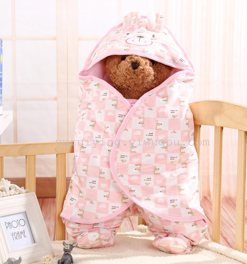 The infant was holding newborn children sleeping bag baby sleeping baby sleeping bag was split kick against the winter
