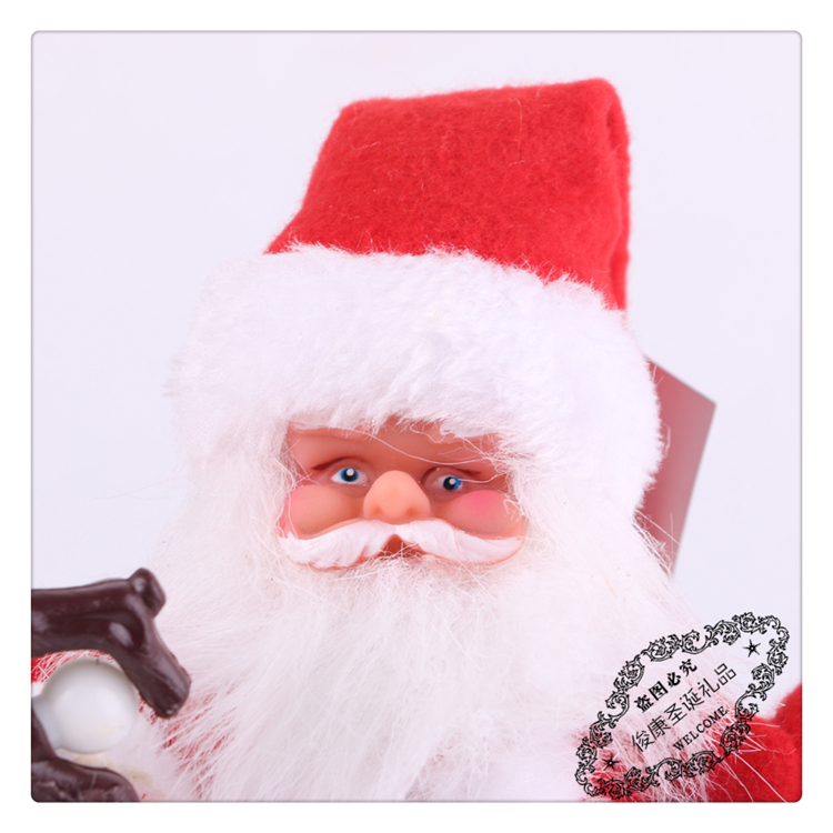 Santa Claus holds a walking stick as a Christmas ornament Santa Claus holds a walking stick as a Christmas ornament