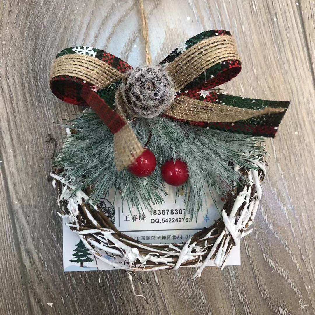 There is a Christmas tree tree hanging Christmas tree circle supplies display