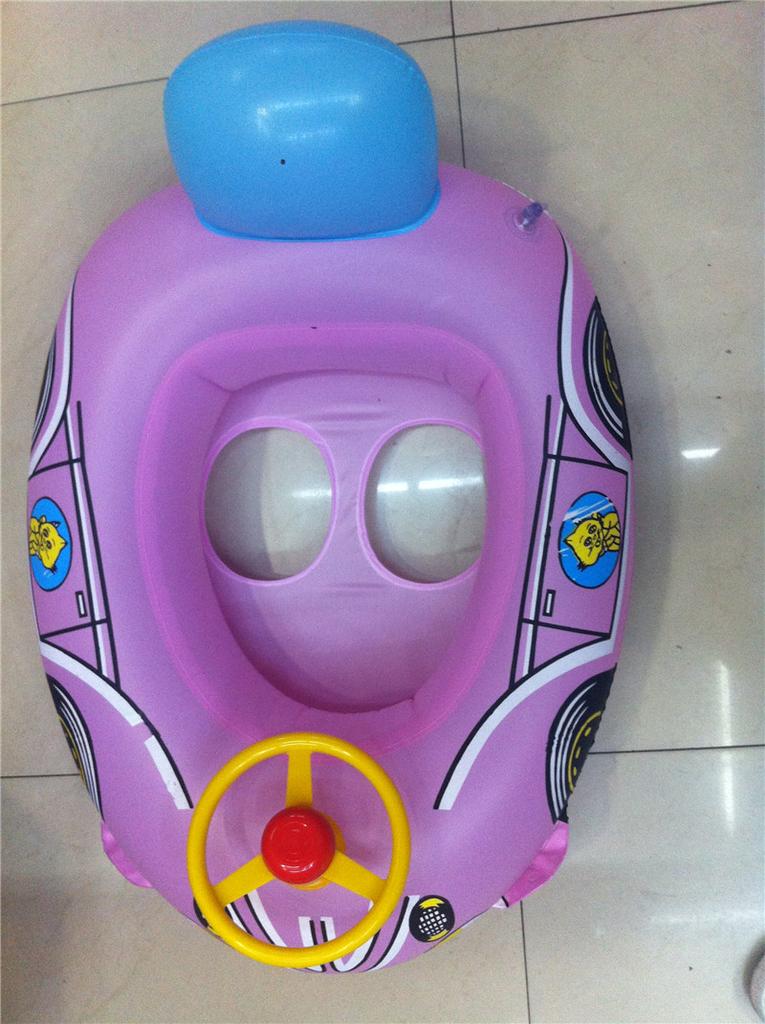 Children&#039;s inflatable toy steering wheel boat on the water with a trumpet