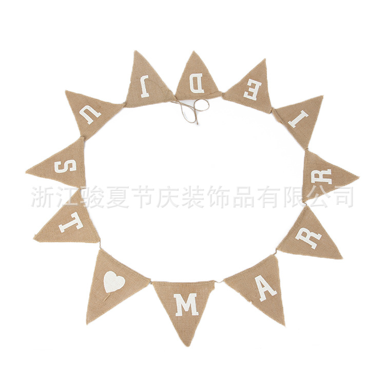 Holiday party decoration: a wedding flag with a linen triangle on the hem