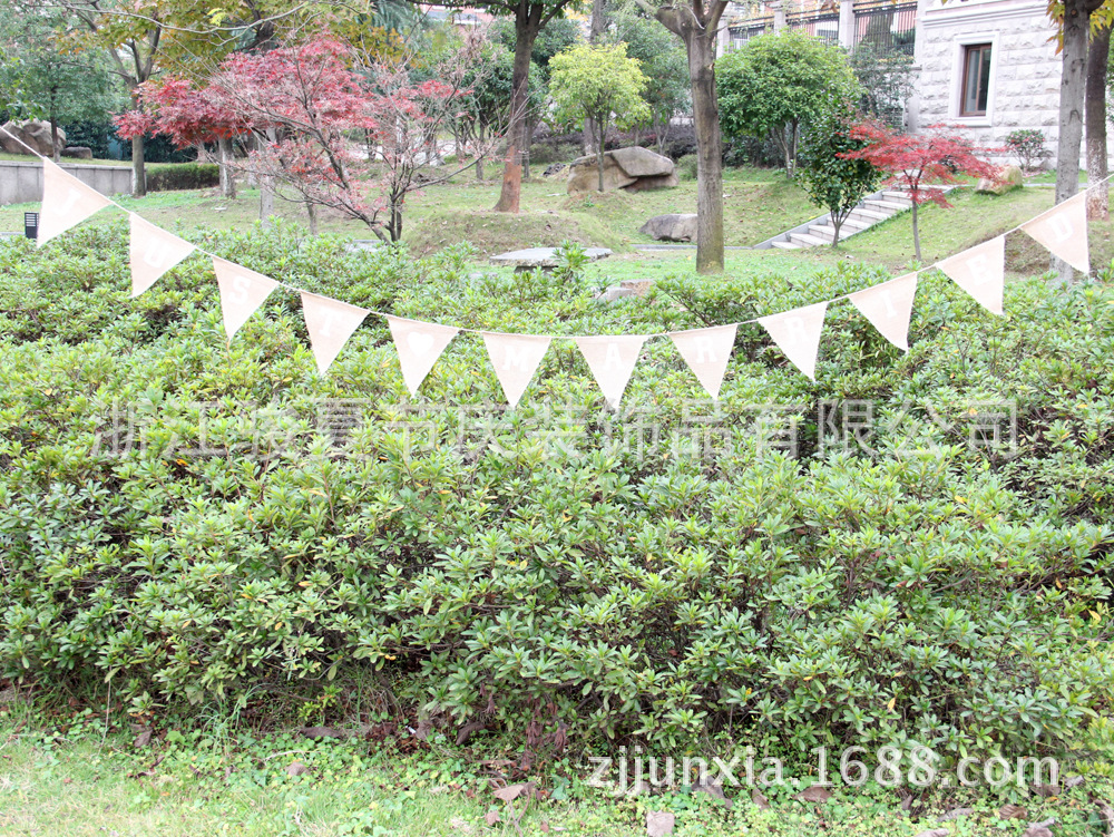 Holiday party decoration: a wedding flag with a linen triangle on the hem