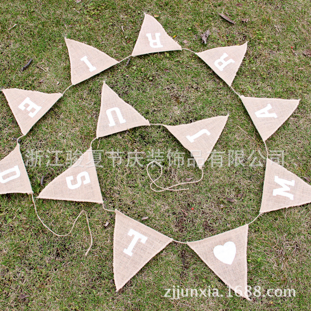Holiday party decoration: a wedding flag with a linen triangle on the hem