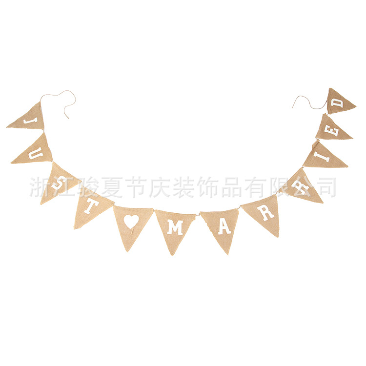 Holiday party decoration: a wedding flag with a linen triangle on the hem