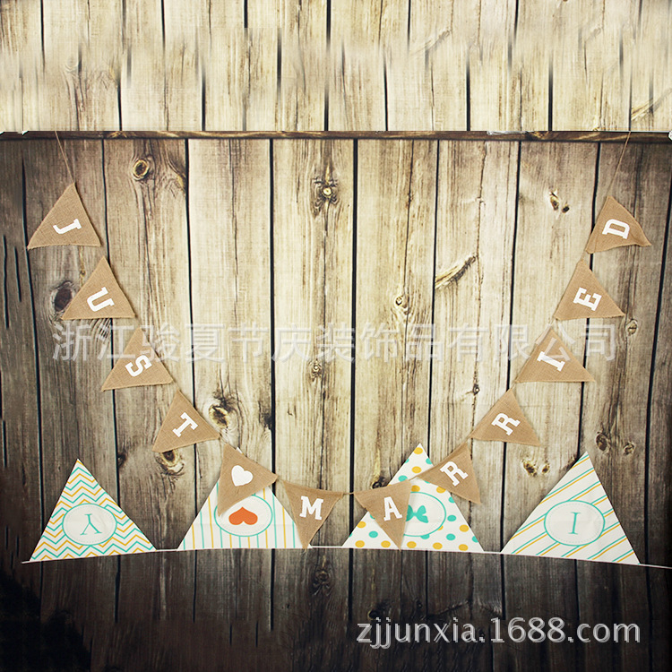 Holiday party decoration: a wedding flag with a linen triangle on the hem