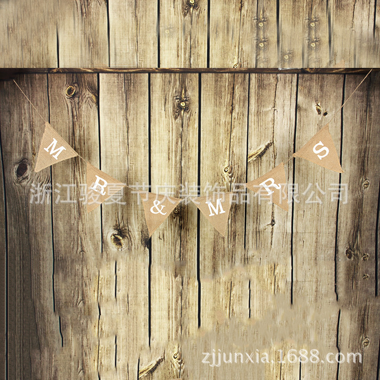 Holiday party decoration: a wedding flag with a linen triangle on the hem