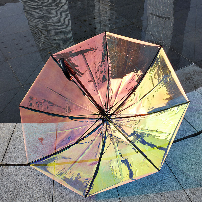 The 2018 new colorful Transparent umbrella with thickening ENING Laser Transparent umbrella with rainbow Film can be customized with automatic long handle umbrella