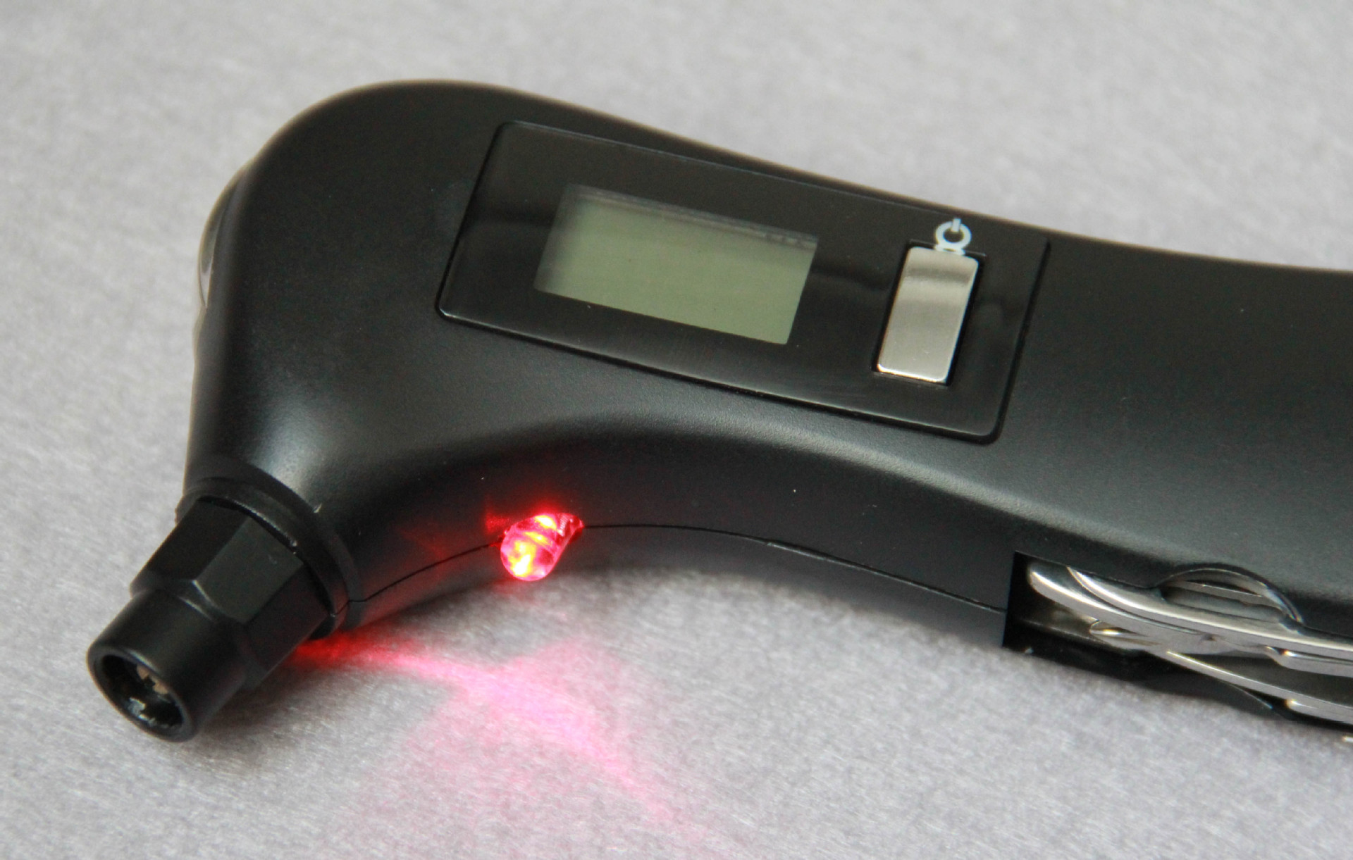 Multifunctional cutter with safety hammer LED lamp digital tire pressure gauge