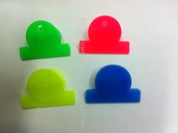 Fine plastic book holder, plastic ticket holder, plastic clip