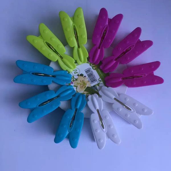 The butterfly shaped plastic clip is used for washing clothes.