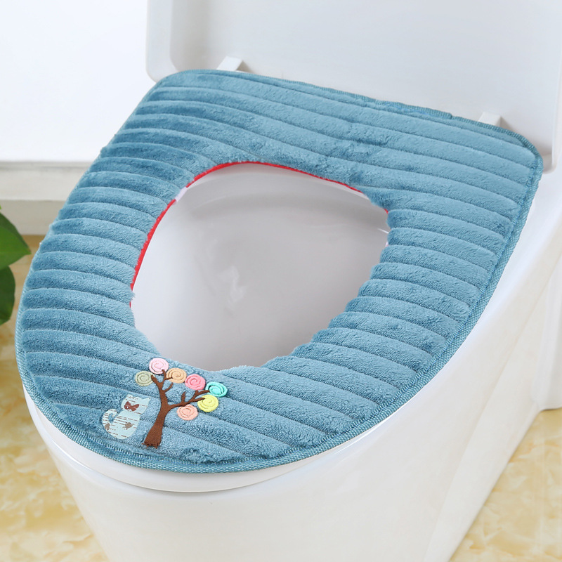 The toilet seat is sitting on the toilet seat, the toilet seat cushion the toilet seat.